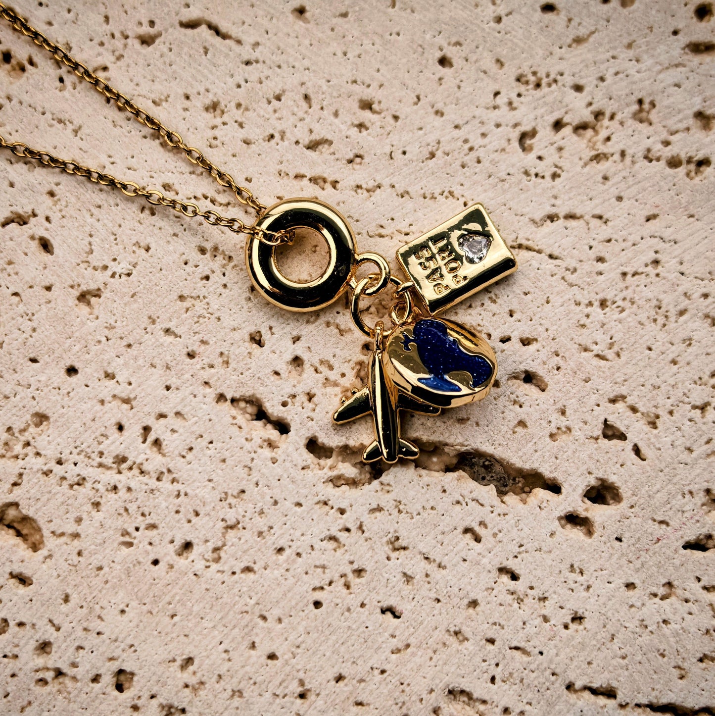 Wanderlust Charm Necklace – Gold‑Plated Plane, Globe & Passport Pendants