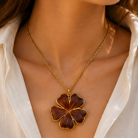 Amber brown flower pendant necklace with 18K gold plated stainless steel twisted chain and glossy enamel floral charm.