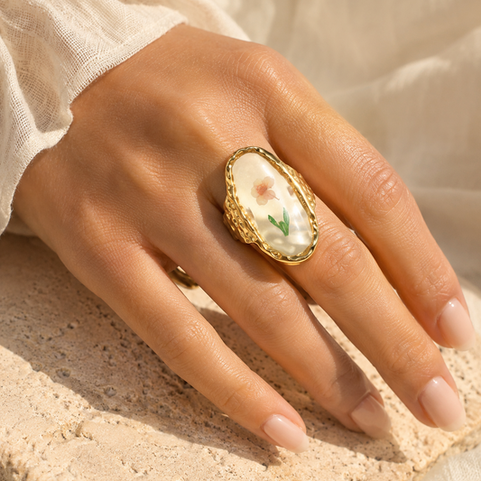 18K gold plated stainless steel oval cherry blossom ring with glossy glass-style floral inlay and adjustable hammered band.