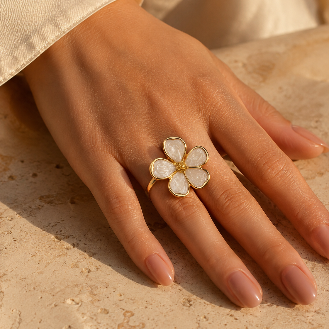 Gold-plated stainless steel white flower open ring with textured petal detailing.