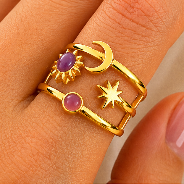 18K gold plated stainless steel open ring with sun, moon and star details and purple resin accent stones.