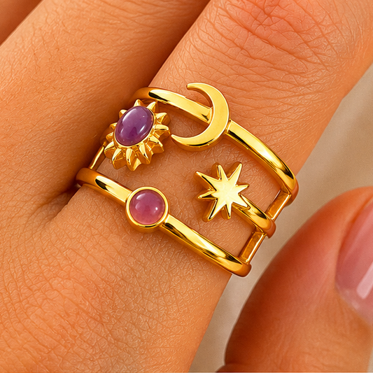 18K gold plated stainless steel open ring with sun, moon and star details and purple resin accent stones.