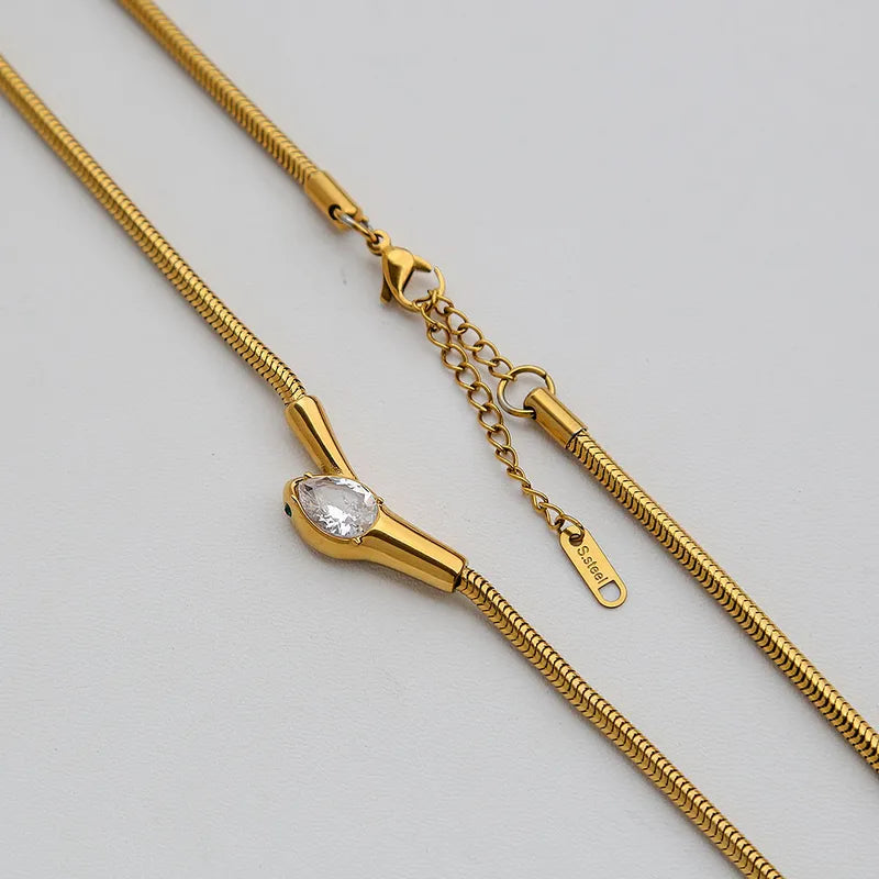 Serpente Crystal Drop Choker Necklace in 18K gold-plated stainless steel with faceted teardrop crystal pendant