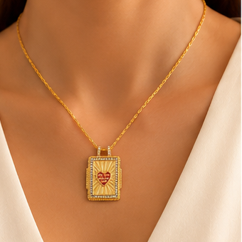 18K gold plated stainless steel rectangular pendant necklace with red heart saying All You Need Is Love, sunburst detail and crystal-style border.